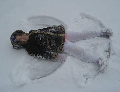 Mia making a snow angel