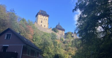 Karlstejn at the end of the hiking trail, above some houses